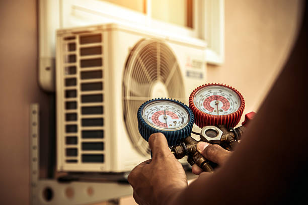 Professional Air Conditioning Service technician working in Corona Del Mar, CA